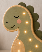 Lampe Dinosaure ORAWOOD, gros plan du visage et du bois
