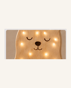 Lampe Ours ORAWOOD, gros plan du bois et des points lumineux